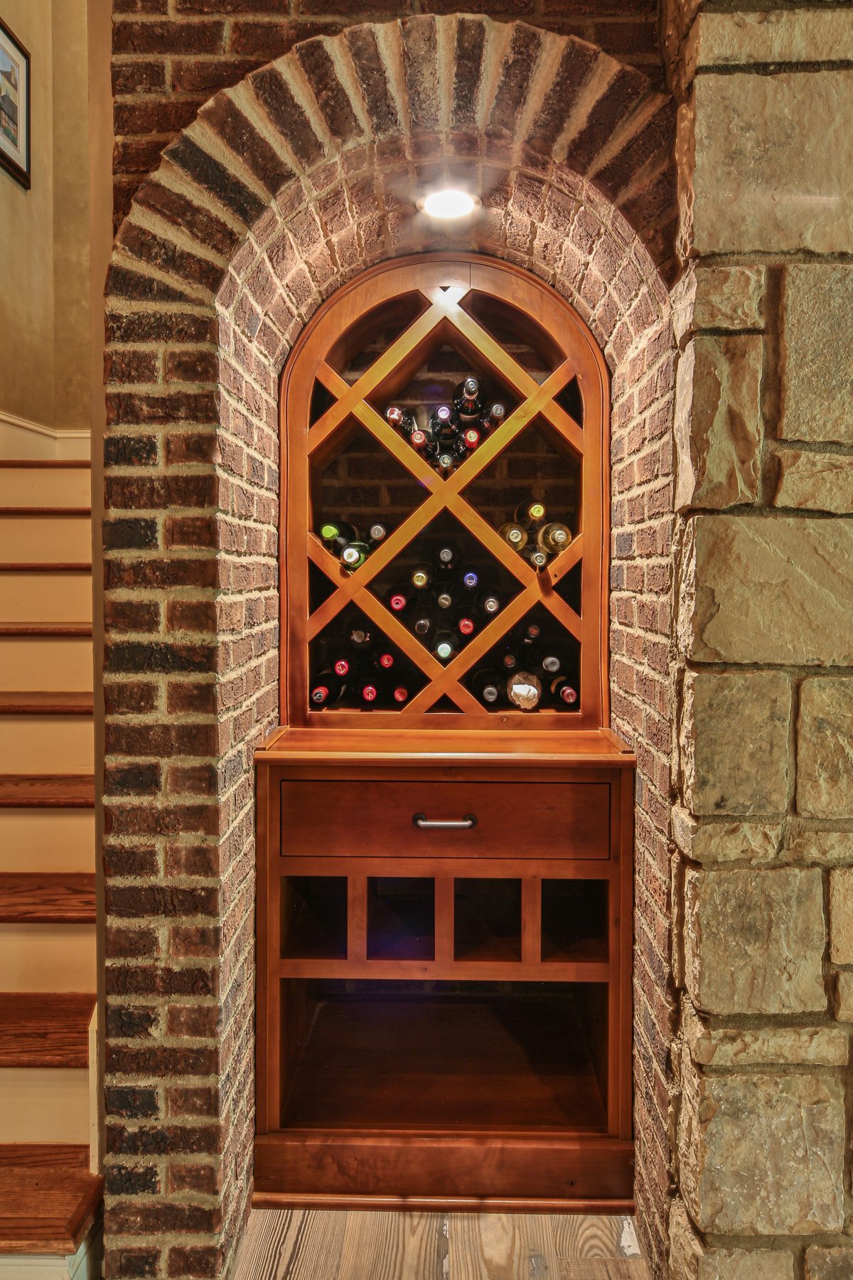 Arched brick wine cellar insert with diamond bottle racking